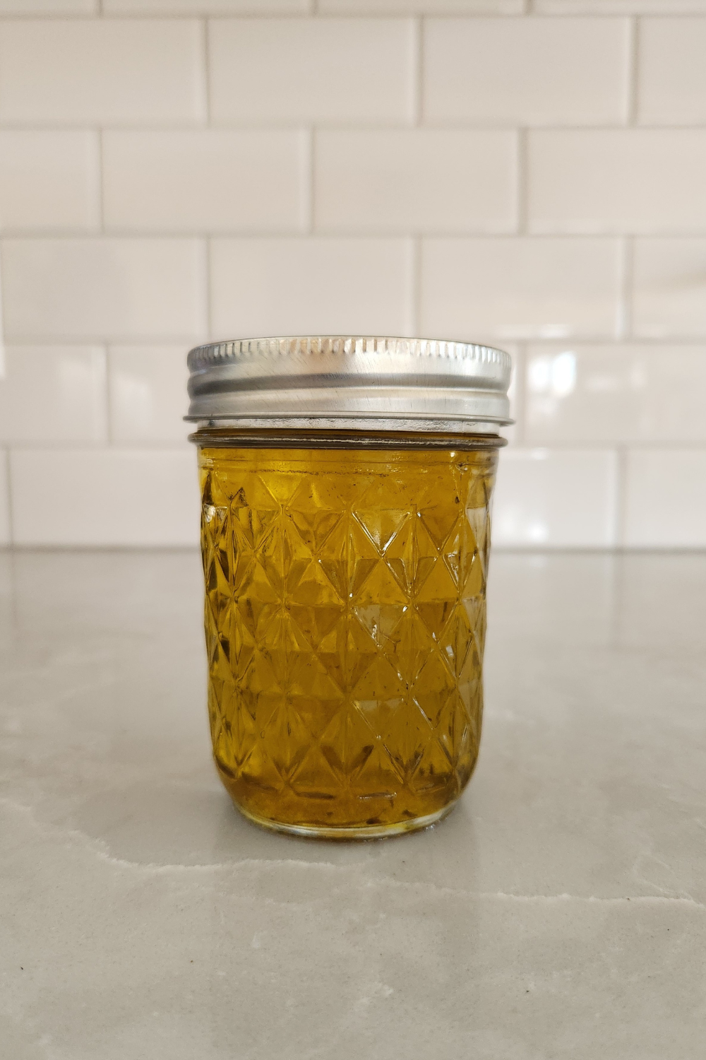 calendula infused oil in glass mason jar