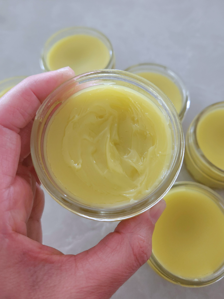Homemade calendula salve with shea butter — smooth, creamy texture in a small glass jar, ready to use for dry or irritated skin.