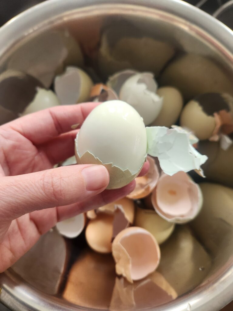 peeling hard-boiled egg