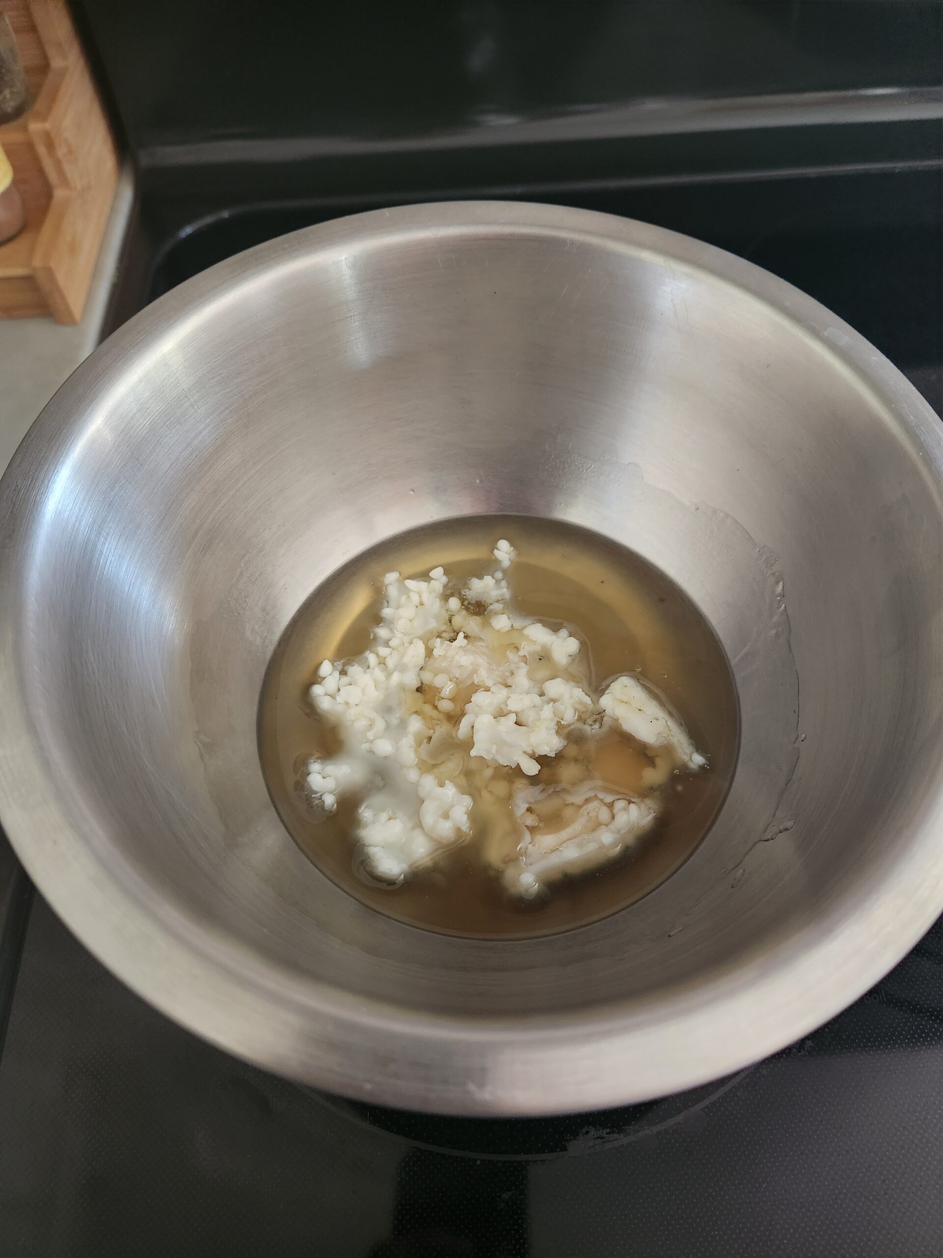 shea butter and beeswax melting in double boiler