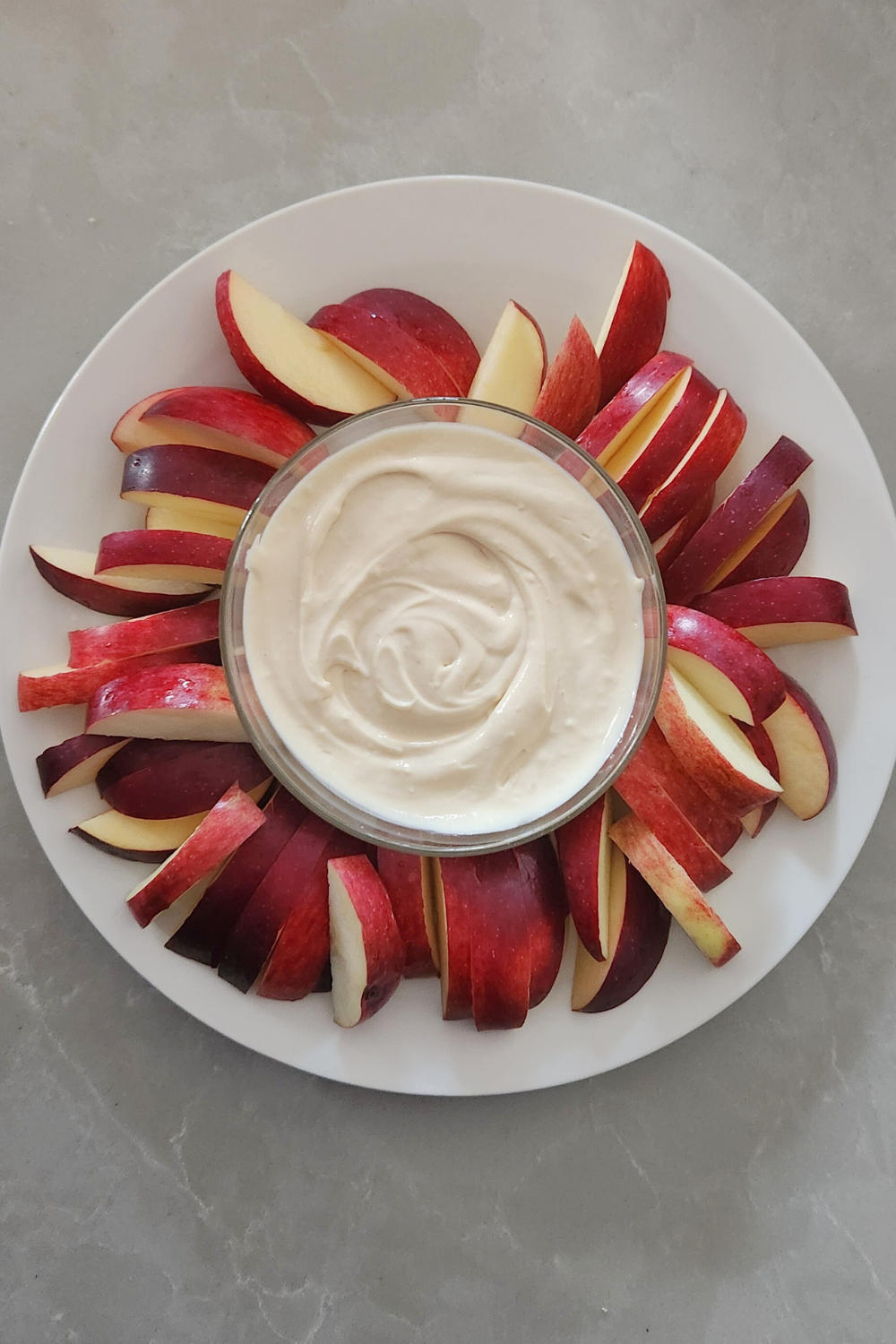 apple dip in a bowl with sliced apples
