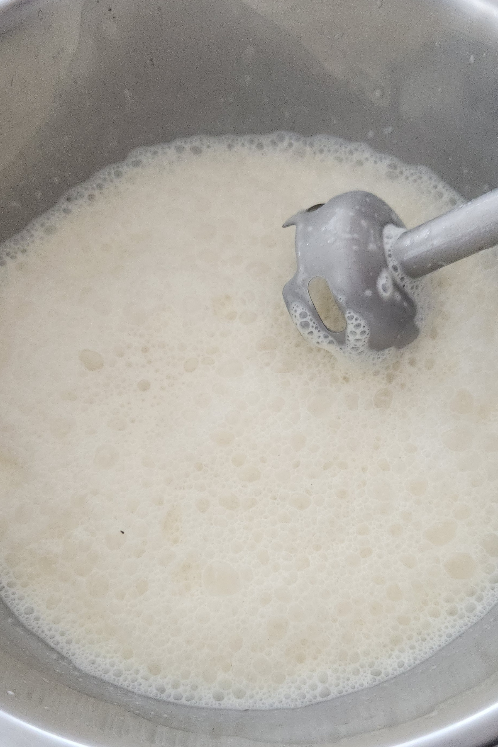 mixing eggnog with immersion blender 