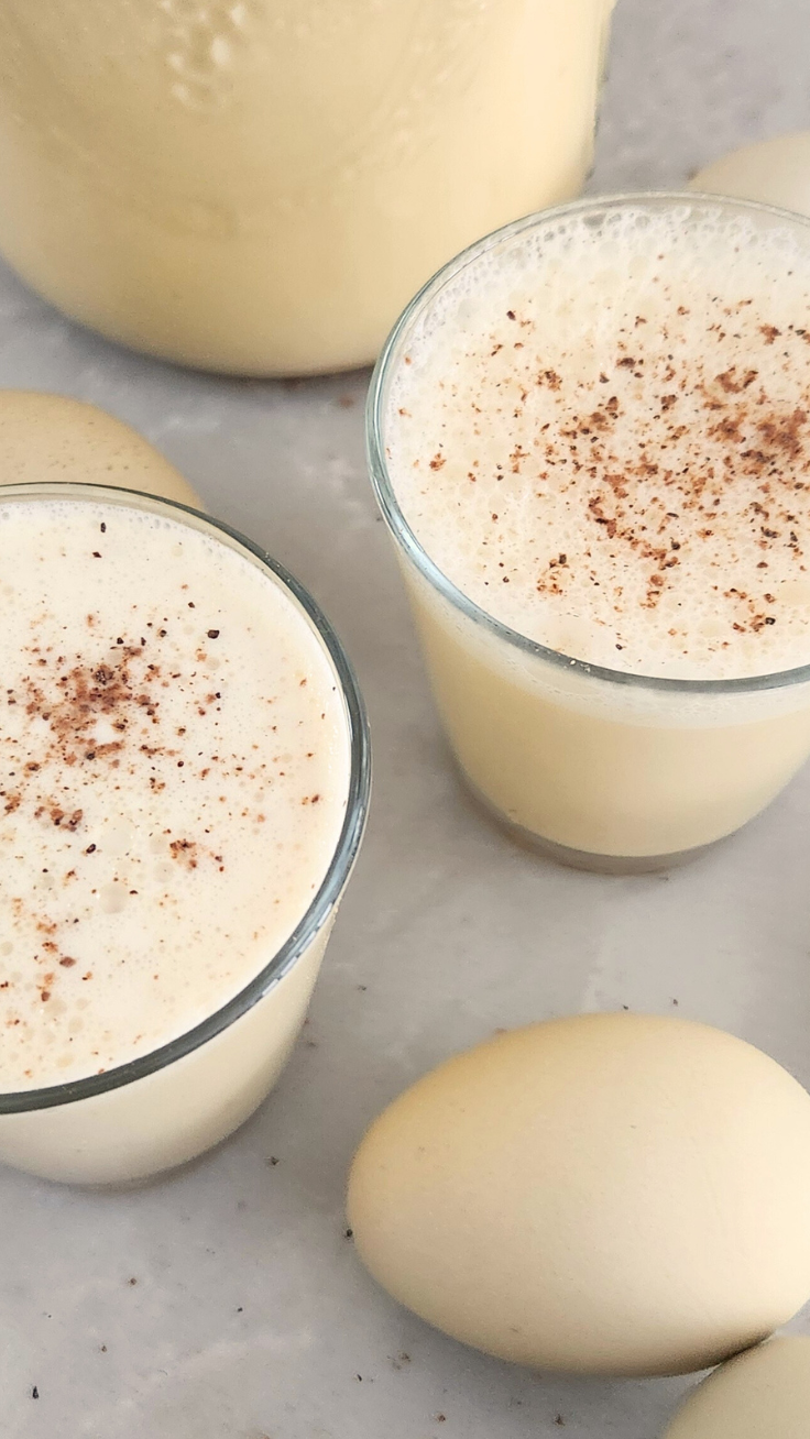two glasses of raw milk eggnog