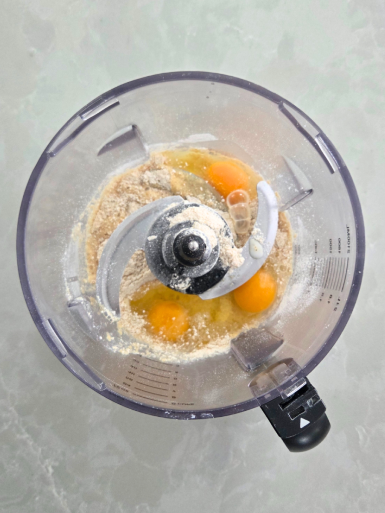 Fresh milled flour Dutch baby pancake batter ingredients in a food processor before blending