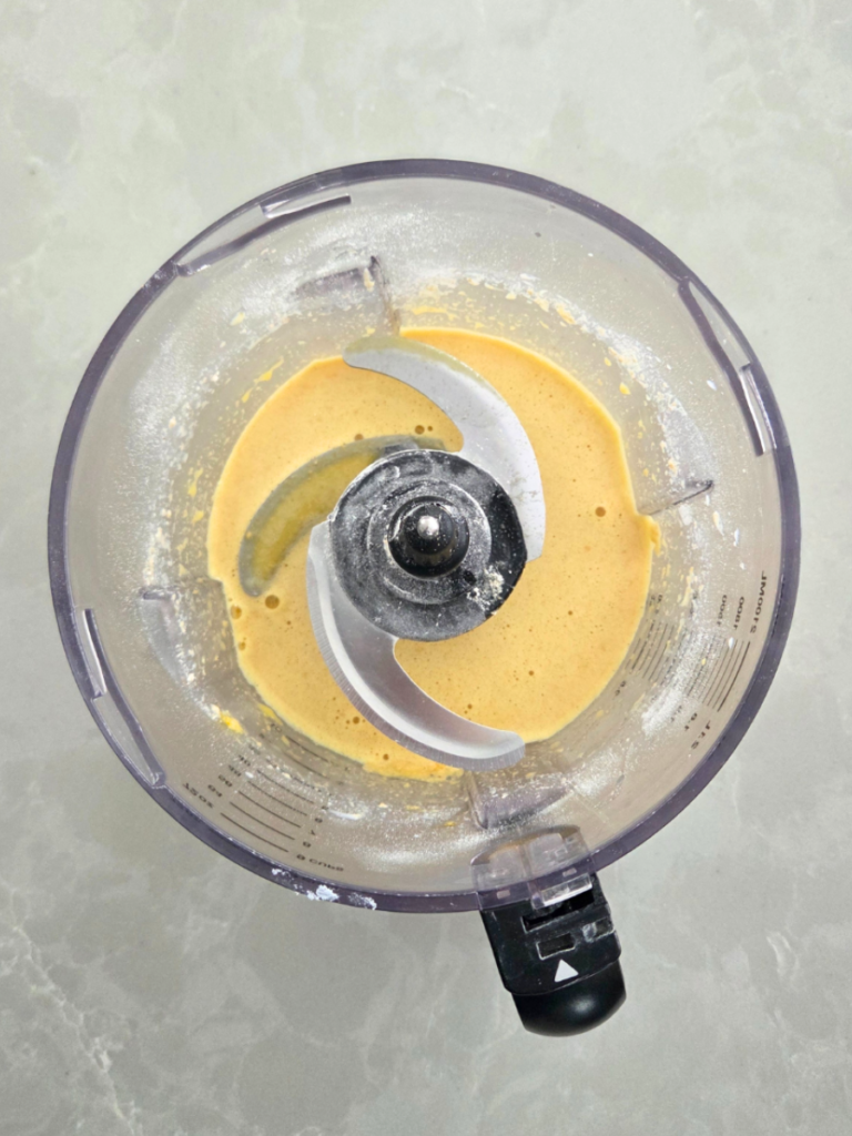 Smooth Dutch baby pancake batter blended in a food processor with fresh milled flour