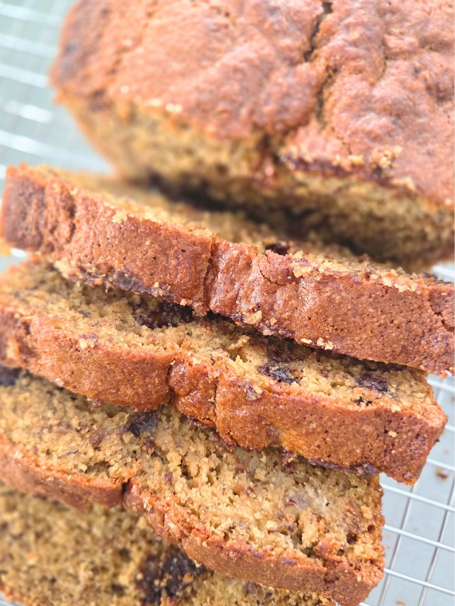Close-up of fresh milled banana bread slices showing a moist crumb and chocolate chips.