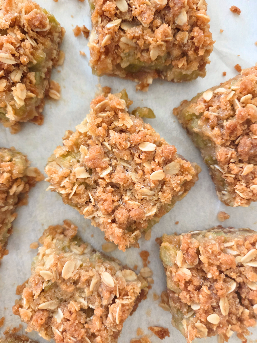 Freshly Milled Rhubarb Crumble Bars with a buttery crust, sweet-tart rhubarb filling, and crisp oat crumble topping.