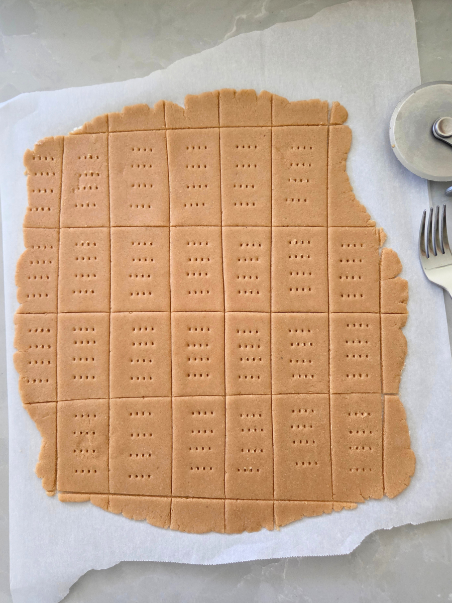Graham cracker rectangles poked with a fork and ready for baking