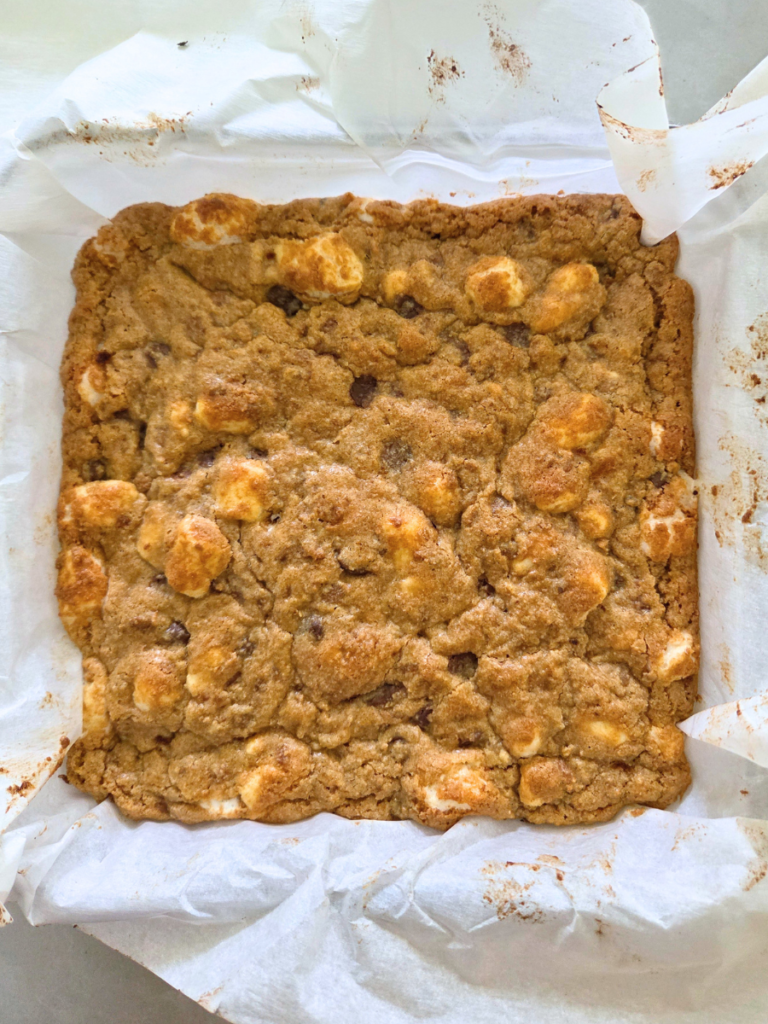 Golden brown s'mores bars after baking with toasted marshmallows and melted chocolate.