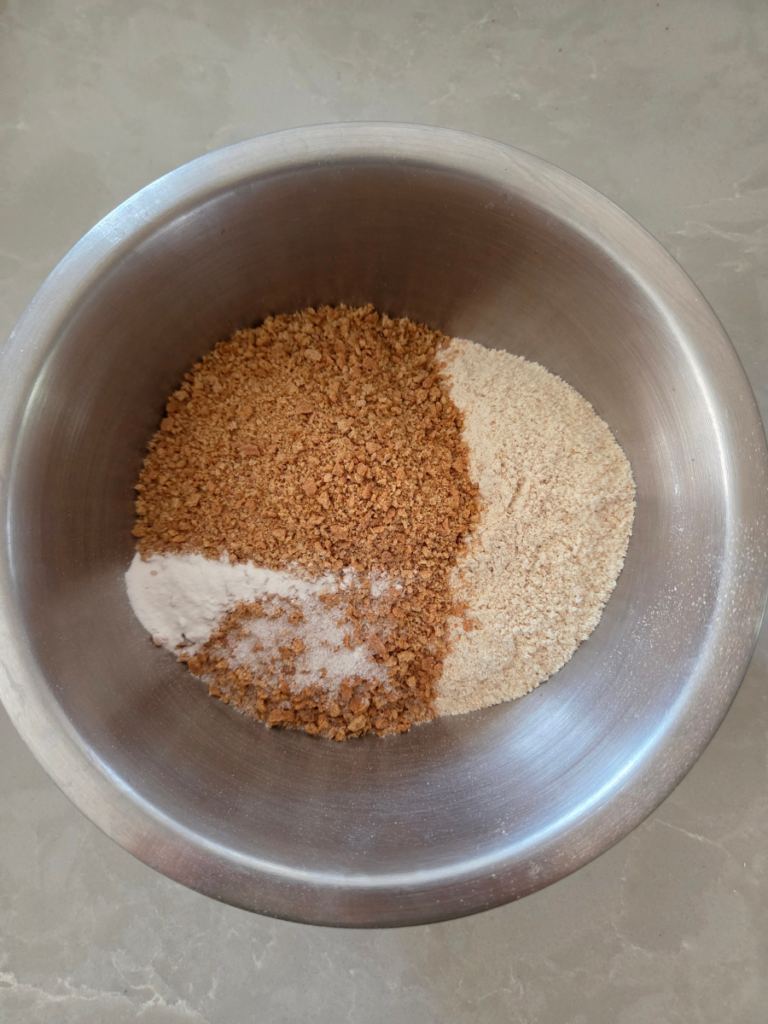 Graham cracker crumbs and freshly milled wheat flour mixed with baking powder and salt for s'mores bars.