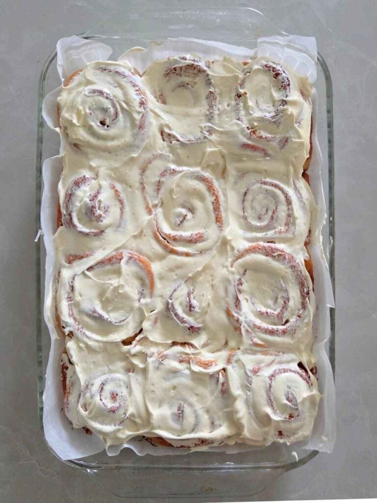 Freshly baked fresh milled cinnamon rolls topped with homemade cream cheese frosting.