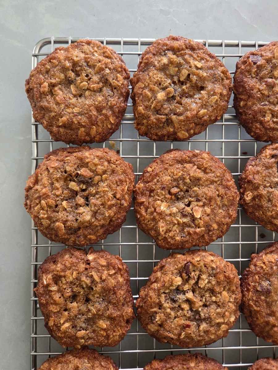 Fresh baked cowboy cookies made with freshly milled flour cooling on a wire rack