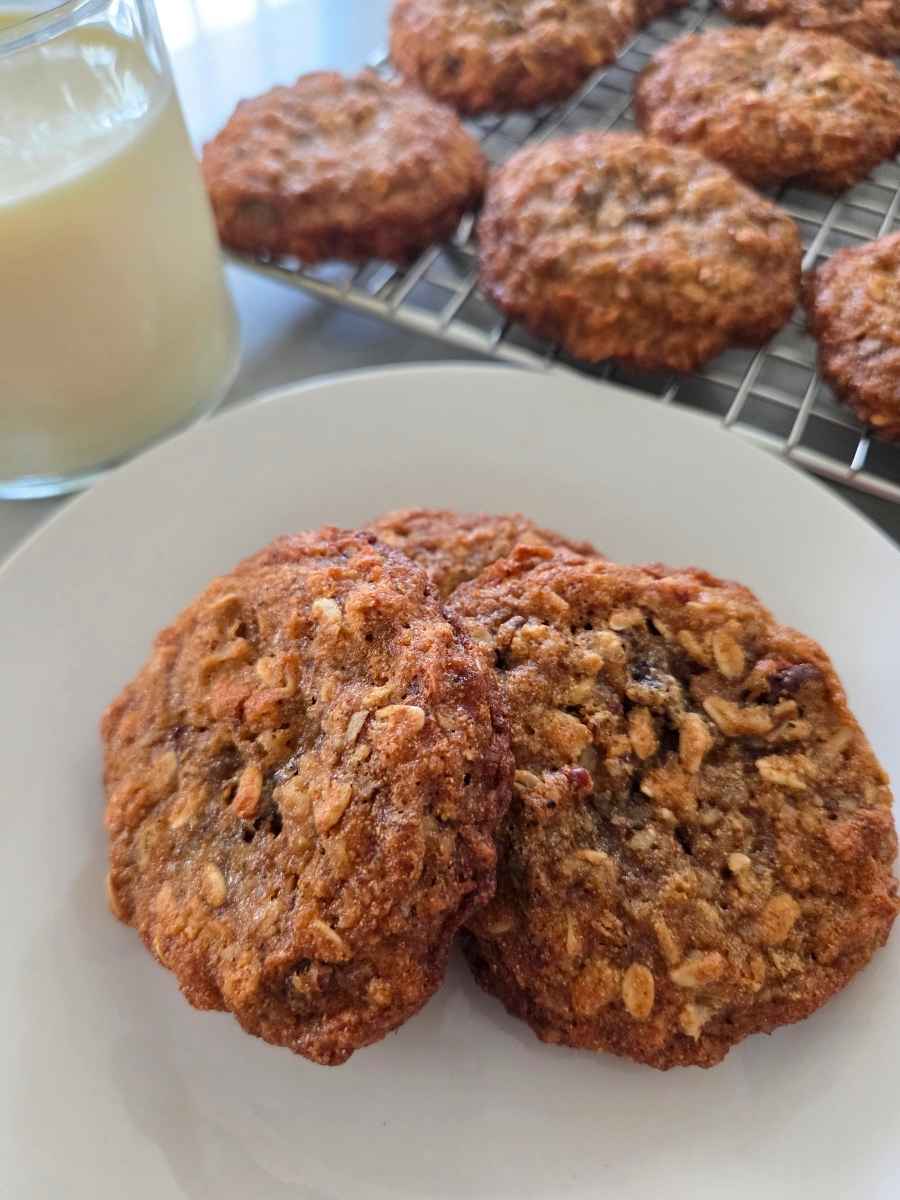 Fresh milled flour cowboy cookies served on a plate with a glass of milk