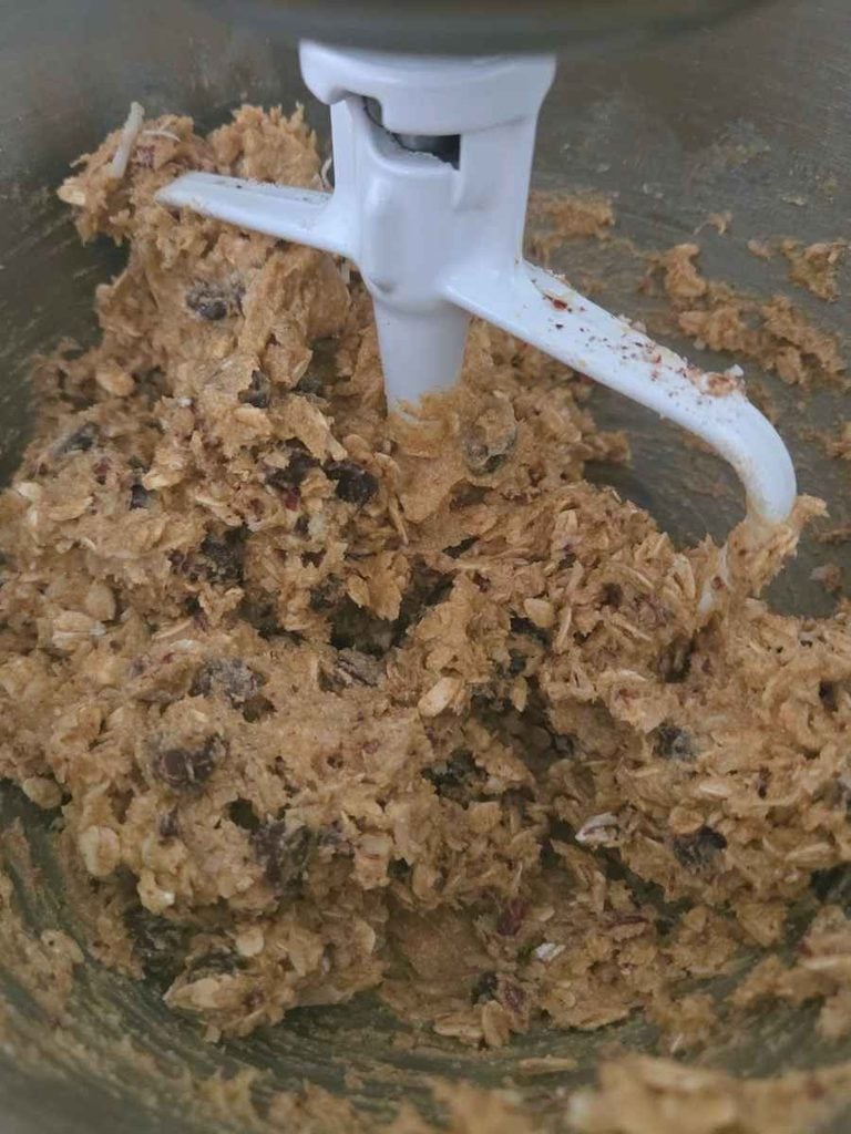 Oats, coconut, chocolate chips, and pecans mixed into cowboy cookie doug