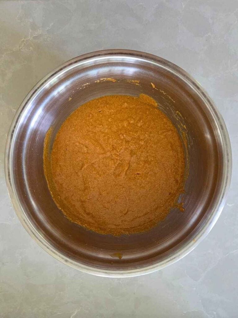 Pumpkin batter in a mixing bowl after resting for 20 minutes.