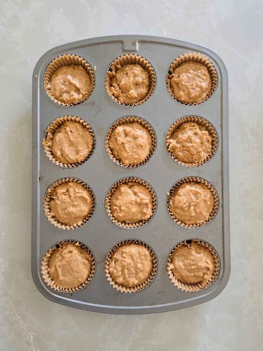 Muffin batter divided evenly among 12 lined muffin cups